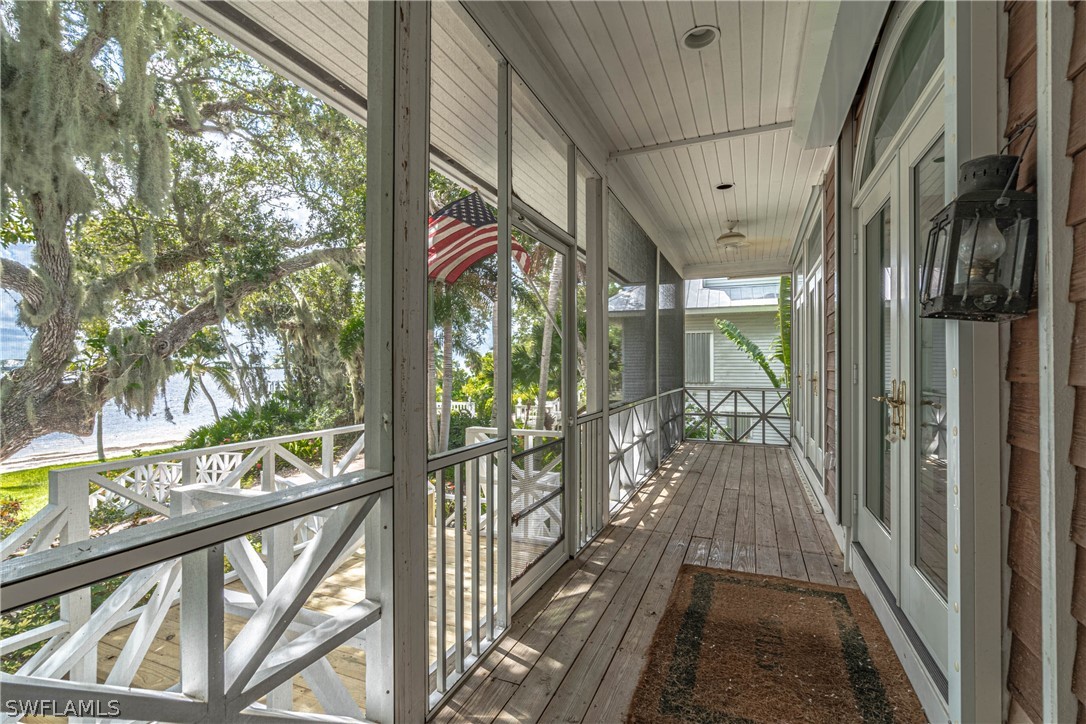 124 Useppa Island Bokeelia, FL 33922 - Photo 2 of 30 a view of balcony with wooden floor