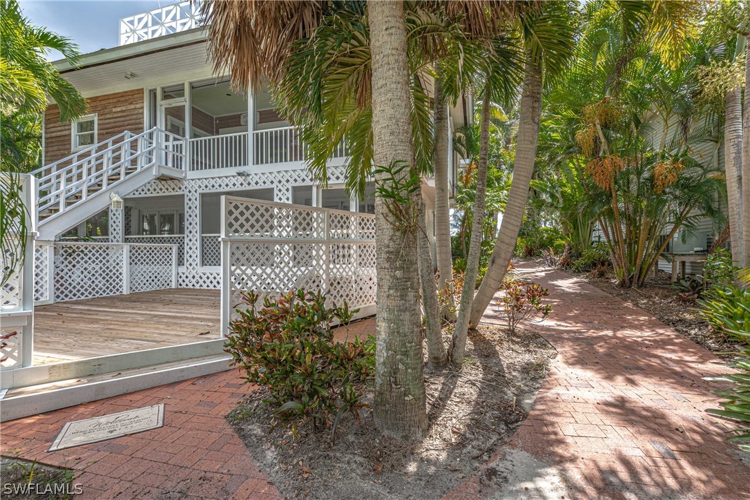 124 Useppa Island Bokeelia, FL 33922 - Photo 21 of 30 a view of a house with backyard and trees