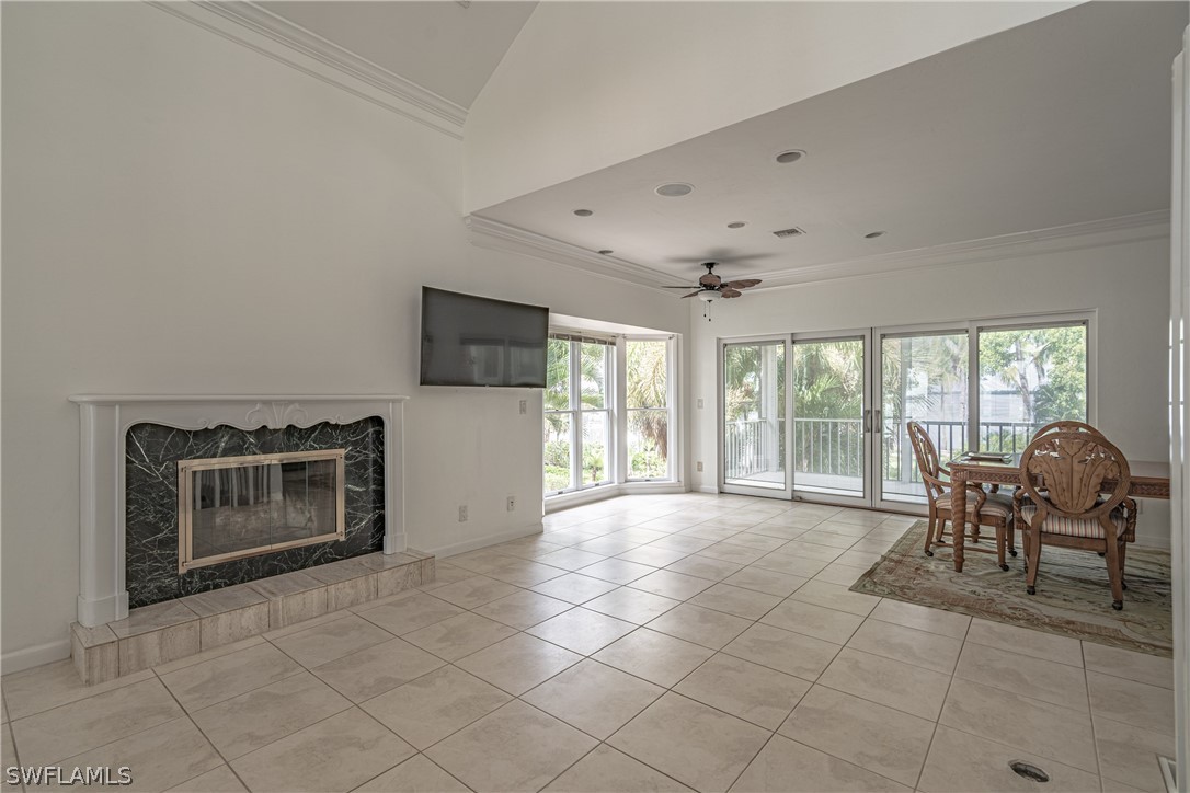 124 Useppa Island Bokeelia, FL 33922 - Photo 4 of 30 a living room with furniture and a fireplace