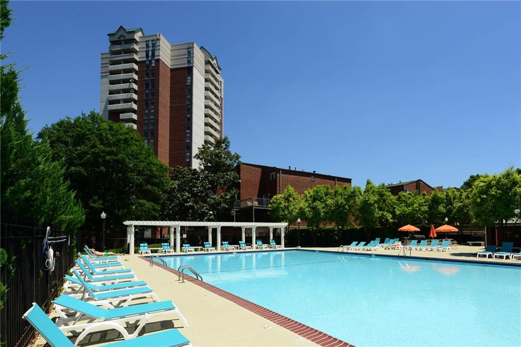 a view of a swimming pool with chairs