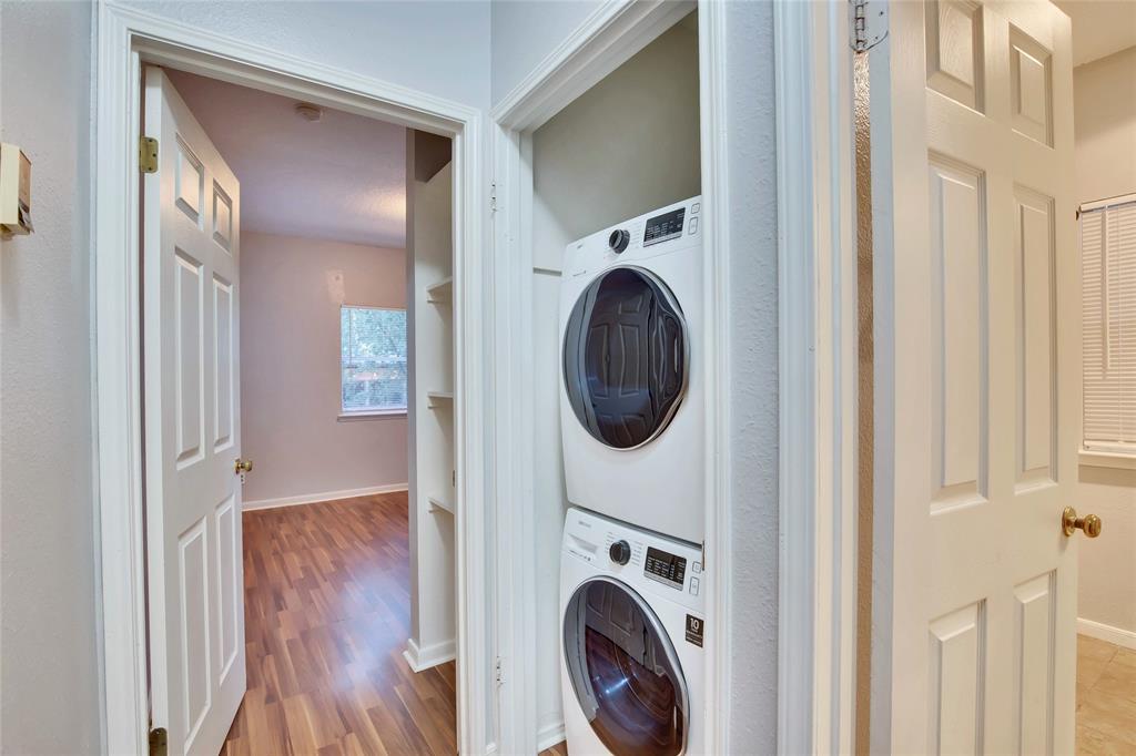 3113 Robinson Avenue, Unit B Austin, TX 78722 - Photo 13 of 16 a view of a hallway with washer and dryer