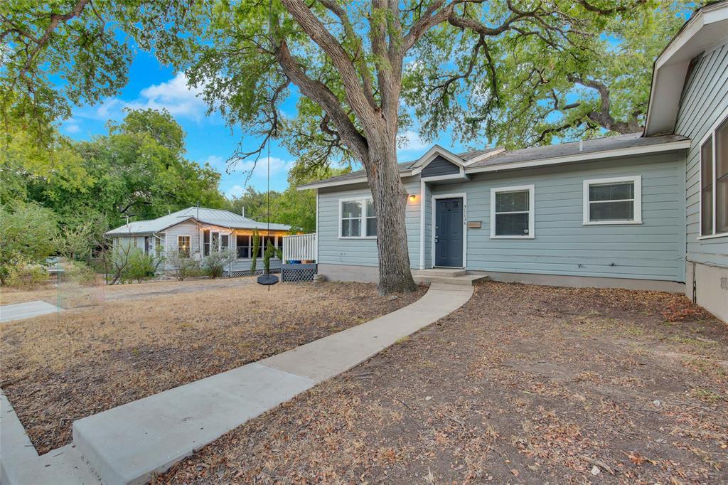 3113 Robinson Avenue, Unit B Austin, TX 78722 - Photo 15 of 16 a view of a house with a yard and large tree