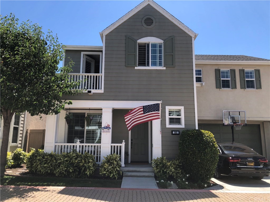 303 Canoe Pond Costa Mesa, CA 92627 - Photo 1 of 49 a front view of a house with a yard