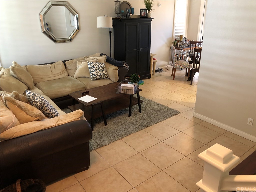 303 Canoe Pond Costa Mesa, CA 92627 - Photo 14 of 49 a living room with furniture and wooden floor