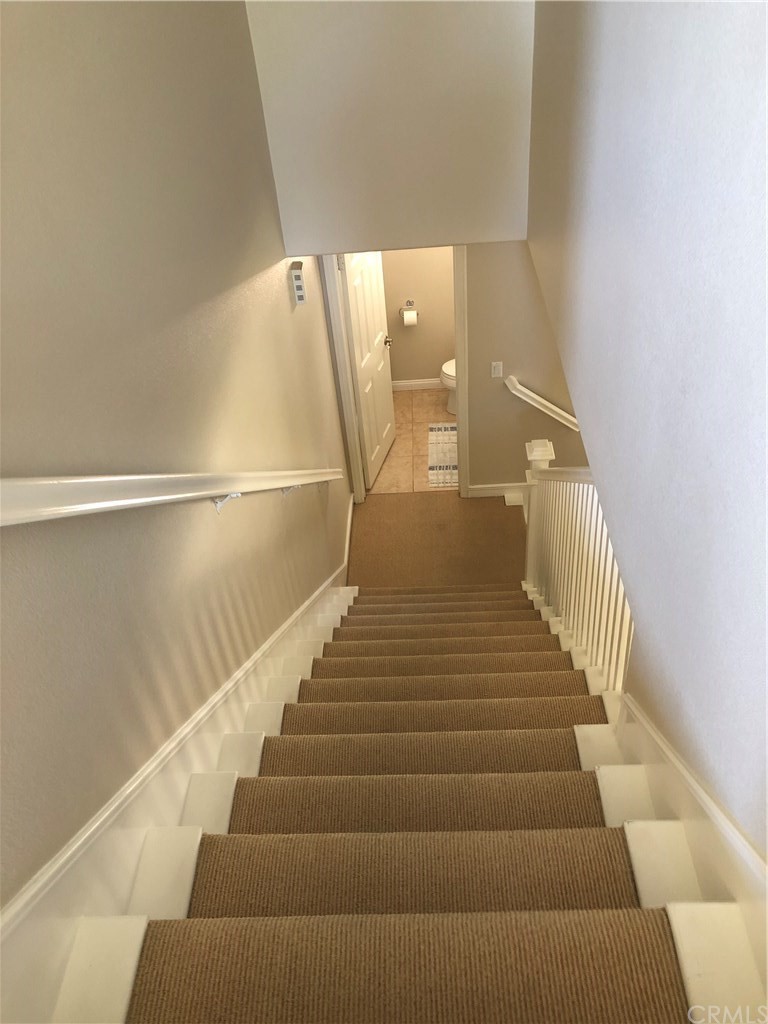 303 Canoe Pond Costa Mesa, CA 92627 - Photo 20 of 49 a view of entryway with wooden floor