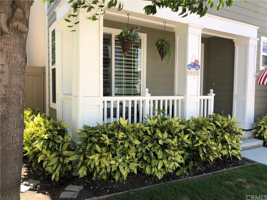 303 Canoe Pond Costa Mesa, CA 92627 - Photo 2 of 49 a view of a house with a flower garden