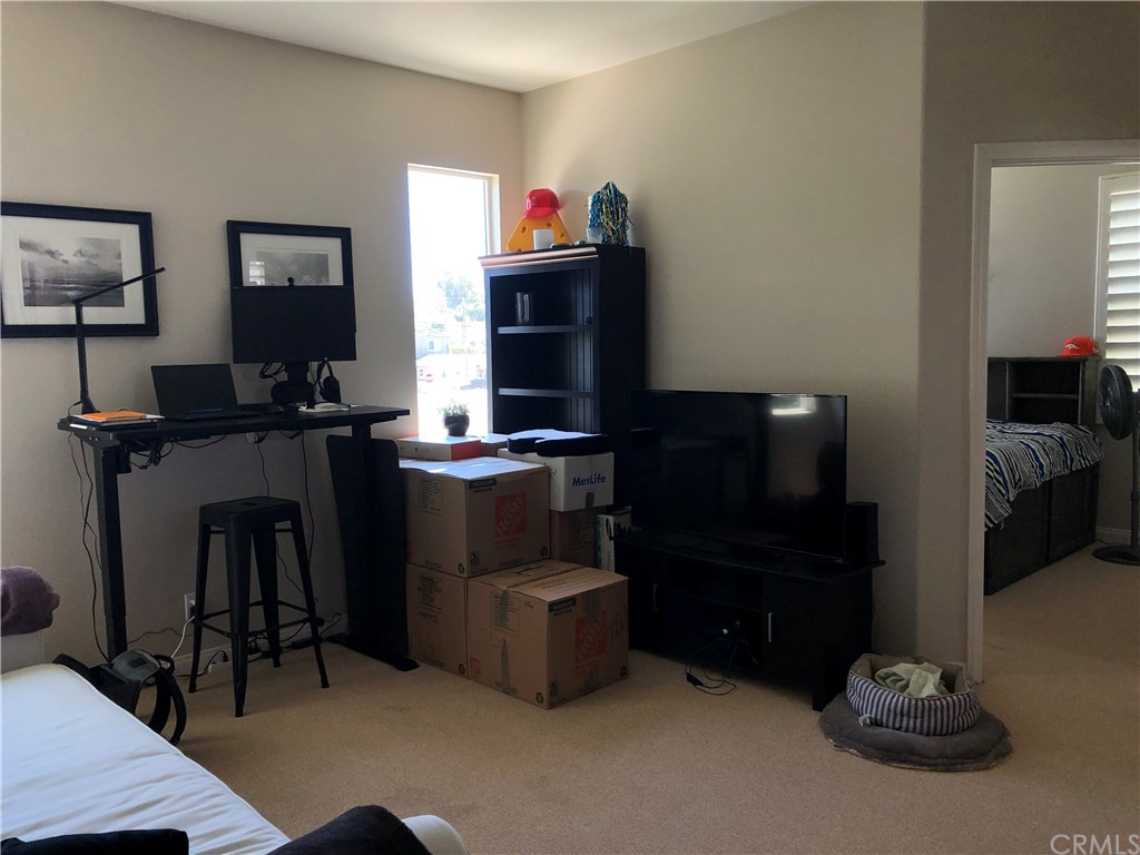303 Canoe Pond Costa Mesa, CA 92627 - Photo 23 of 49 a kitchen with a refrigerator and a stove top oven