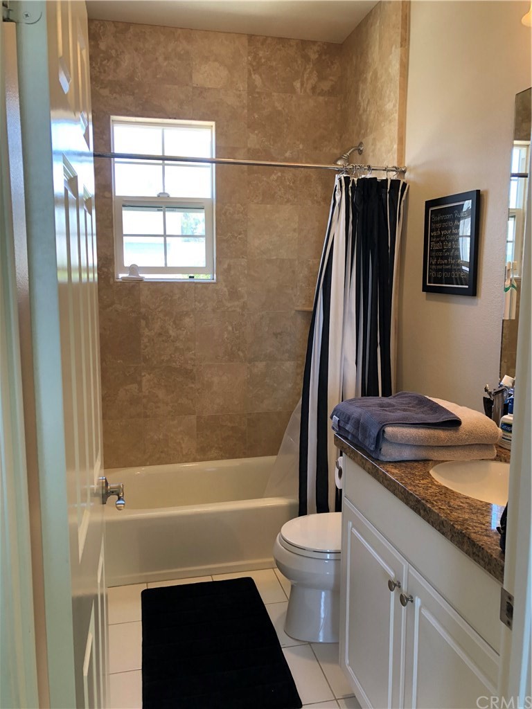 303 Canoe Pond Costa Mesa, CA 92627 - Photo 25 of 49 a bathroom with a granite countertop sink toilet and shower