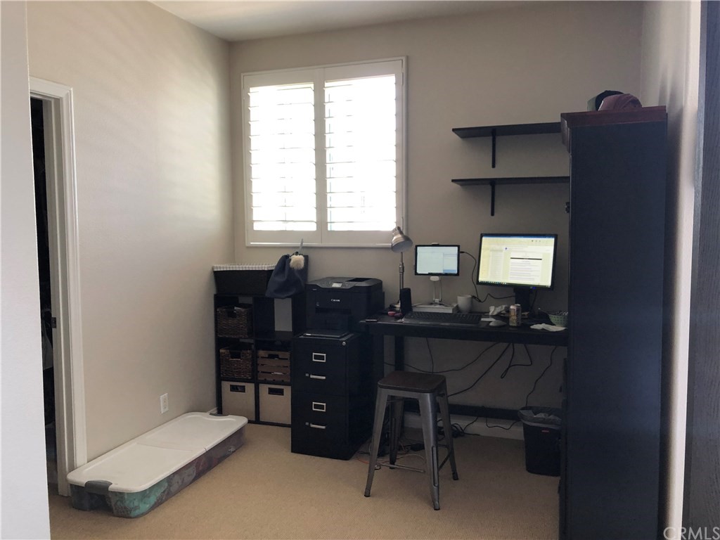 303 Canoe Pond Costa Mesa, CA 92627 - Photo 27 of 49 a room with a desk and a window