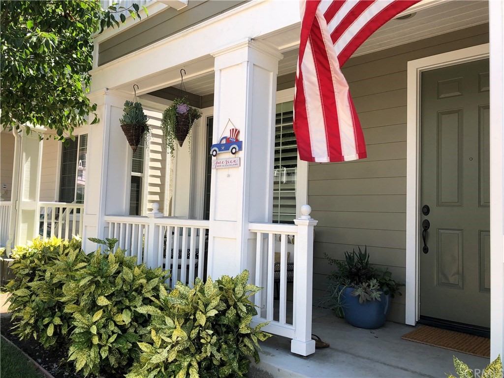 303 Canoe Pond Costa Mesa, CA 92627 - Photo 3 of 49 a view of a house with a flower garden