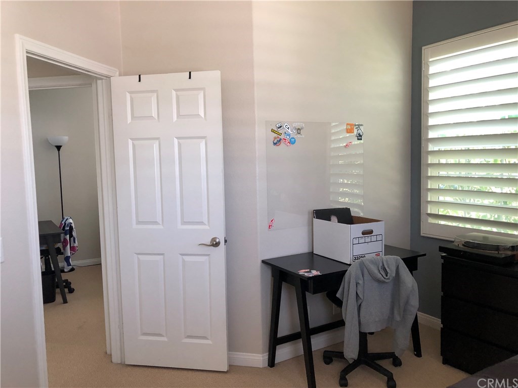 303 Canoe Pond Costa Mesa, CA 92627 - Photo 40 of 49 a workspace with furniture and a window