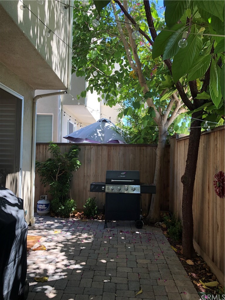 303 Canoe Pond Costa Mesa, CA 92627 - Photo 45 of 49 a backyard of a house with seating space