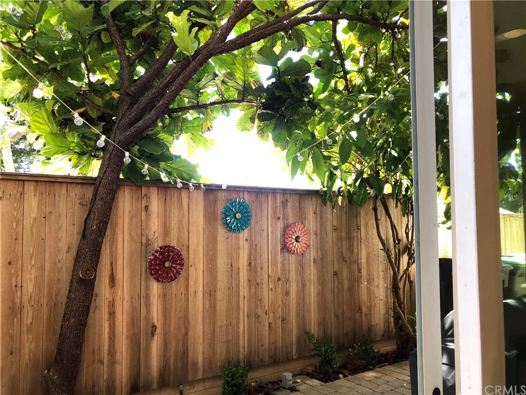 303 Canoe Pond Costa Mesa, CA 92627 - Photo 46 of 49 a view of outdoor space with a sink and wooden fence