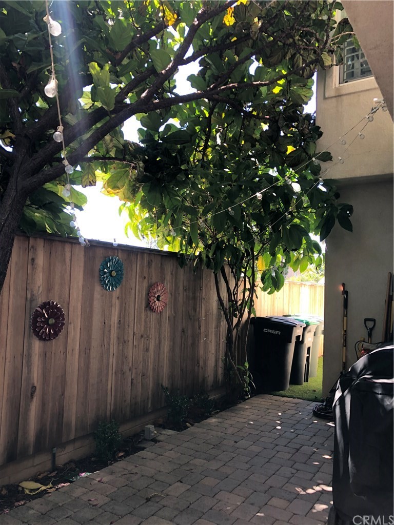303 Canoe Pond Costa Mesa, CA 92627 - Photo 47 of 49 a backyard of a house with seating space