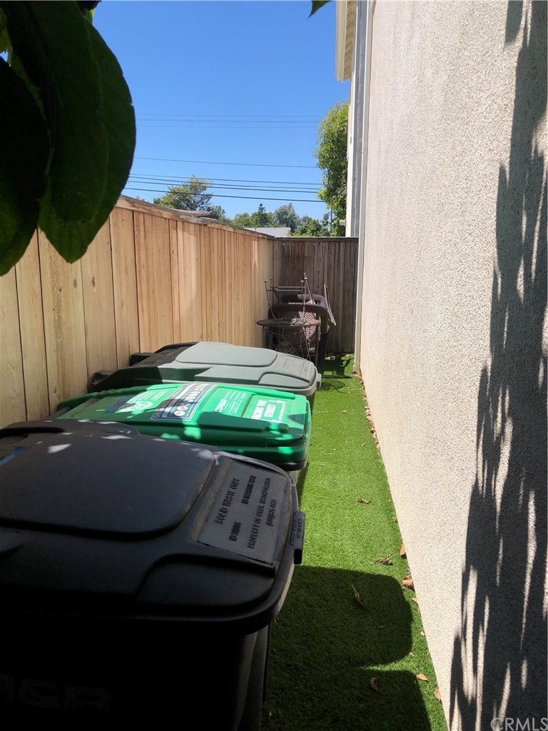 303 Canoe Pond Costa Mesa, CA 92627 - Photo 48 of 49 a backyard of a house with table and chairs