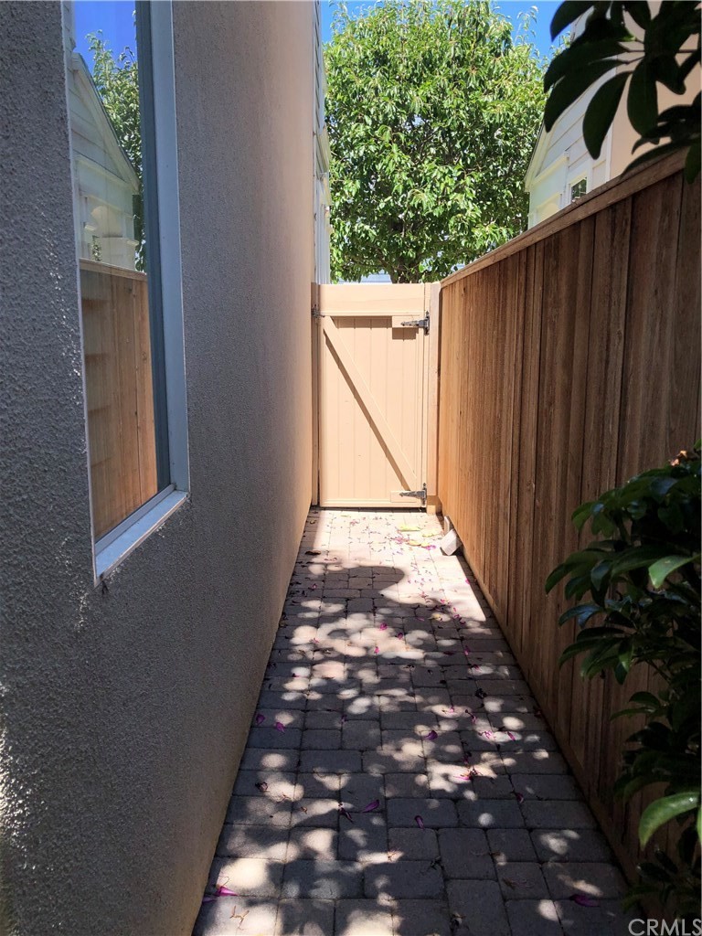 303 Canoe Pond Costa Mesa, CA 92627 - Photo 49 of 49 a view of backyard with pathway and a pathway