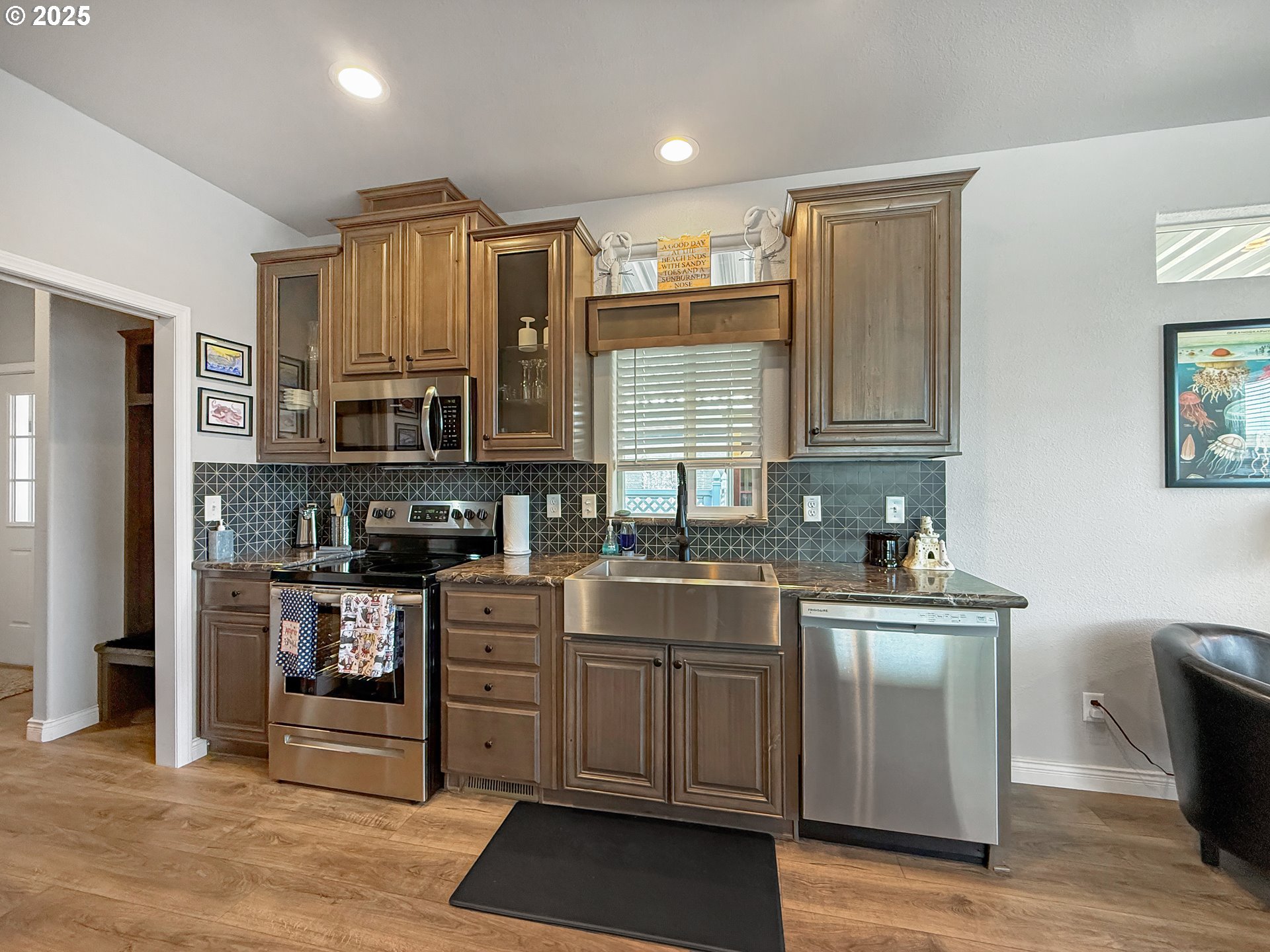 15889 Sunset Strip, Unit 44 Brookings, OR 97415 - Photo 11 of 44 a kitchen with stainless steel appliances a stove sink and cabinets