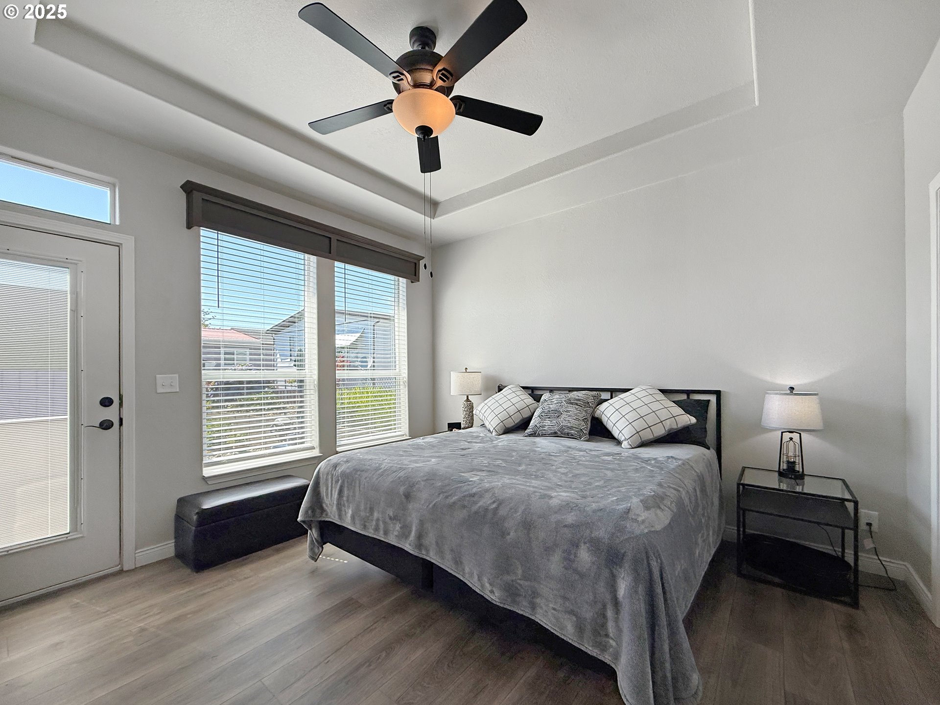 15889 Sunset Strip, Unit 44 Brookings, OR 97415 - Photo 15 of 44 a bedroom with a bed and a large window