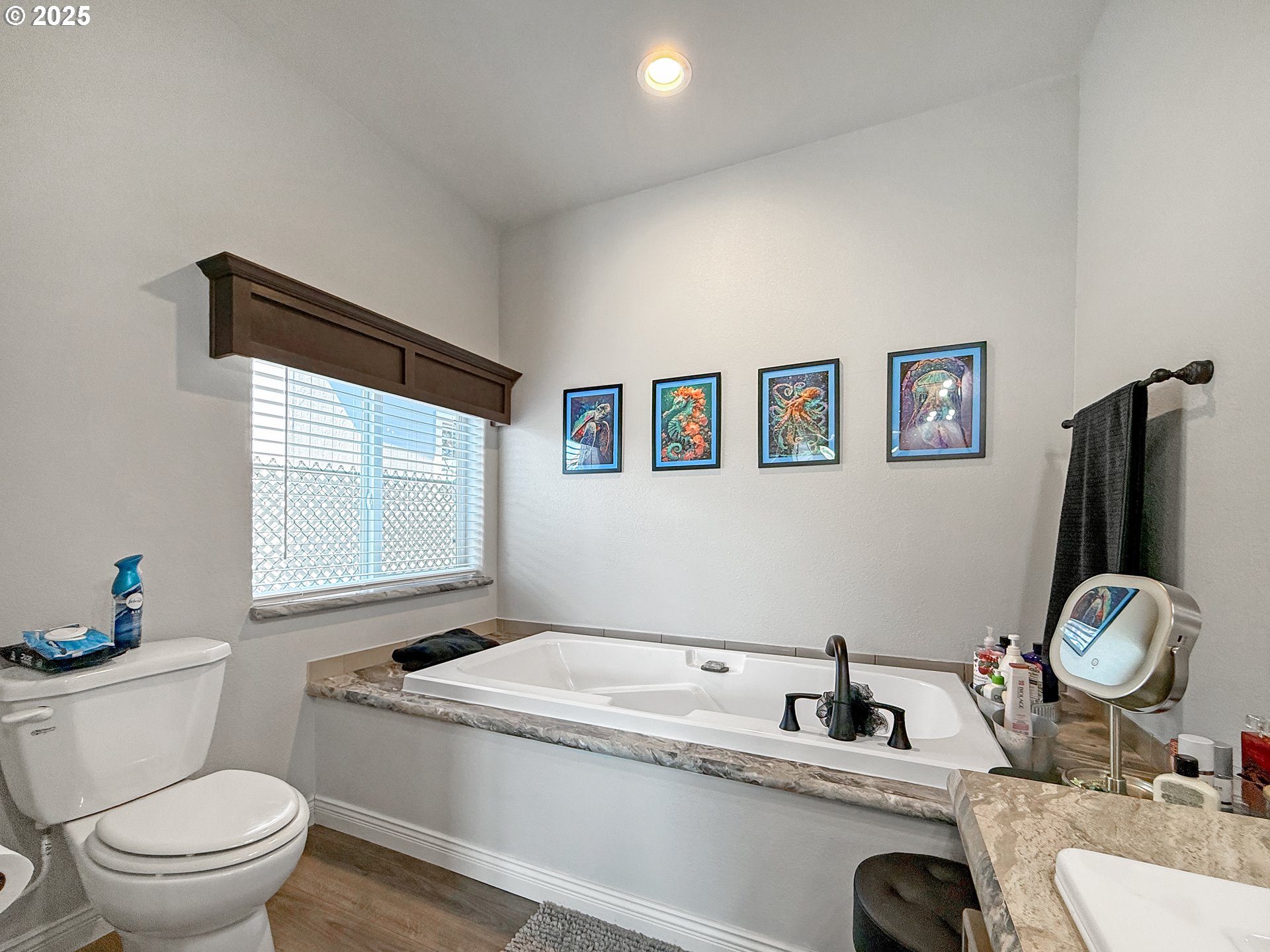 15889 Sunset Strip, Unit 44 Brookings, OR 97415 - Photo 18 of 44 a bathroom with a granite countertop sink mirror vanity and toilet