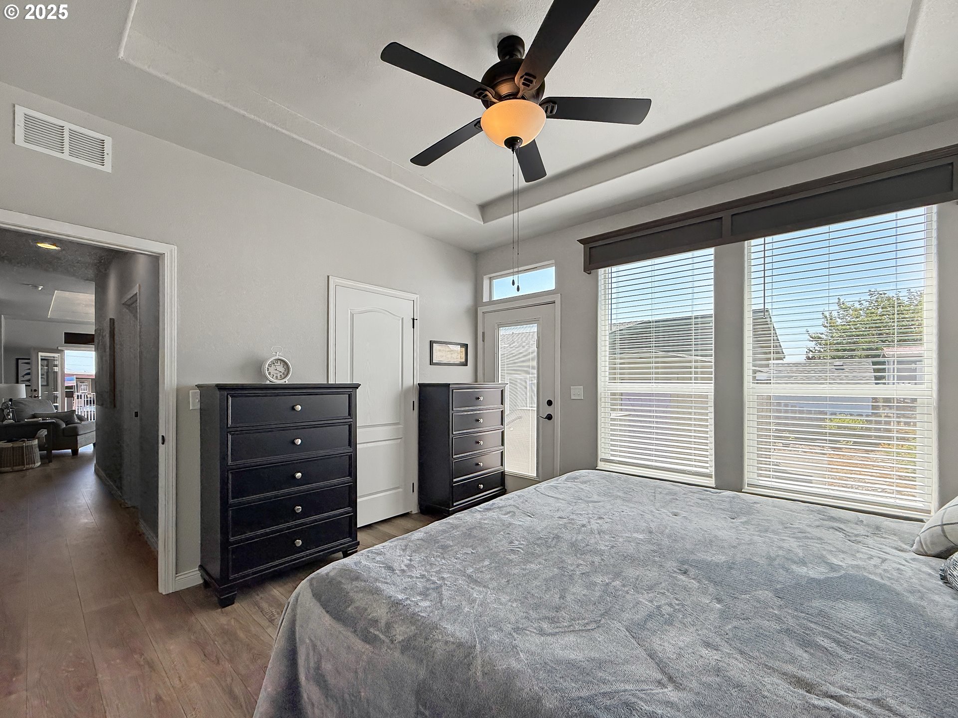 15889 Sunset Strip, Unit 44 Brookings, OR 97415 - Photo 21 of 44 a bedroom with a bed and a large window