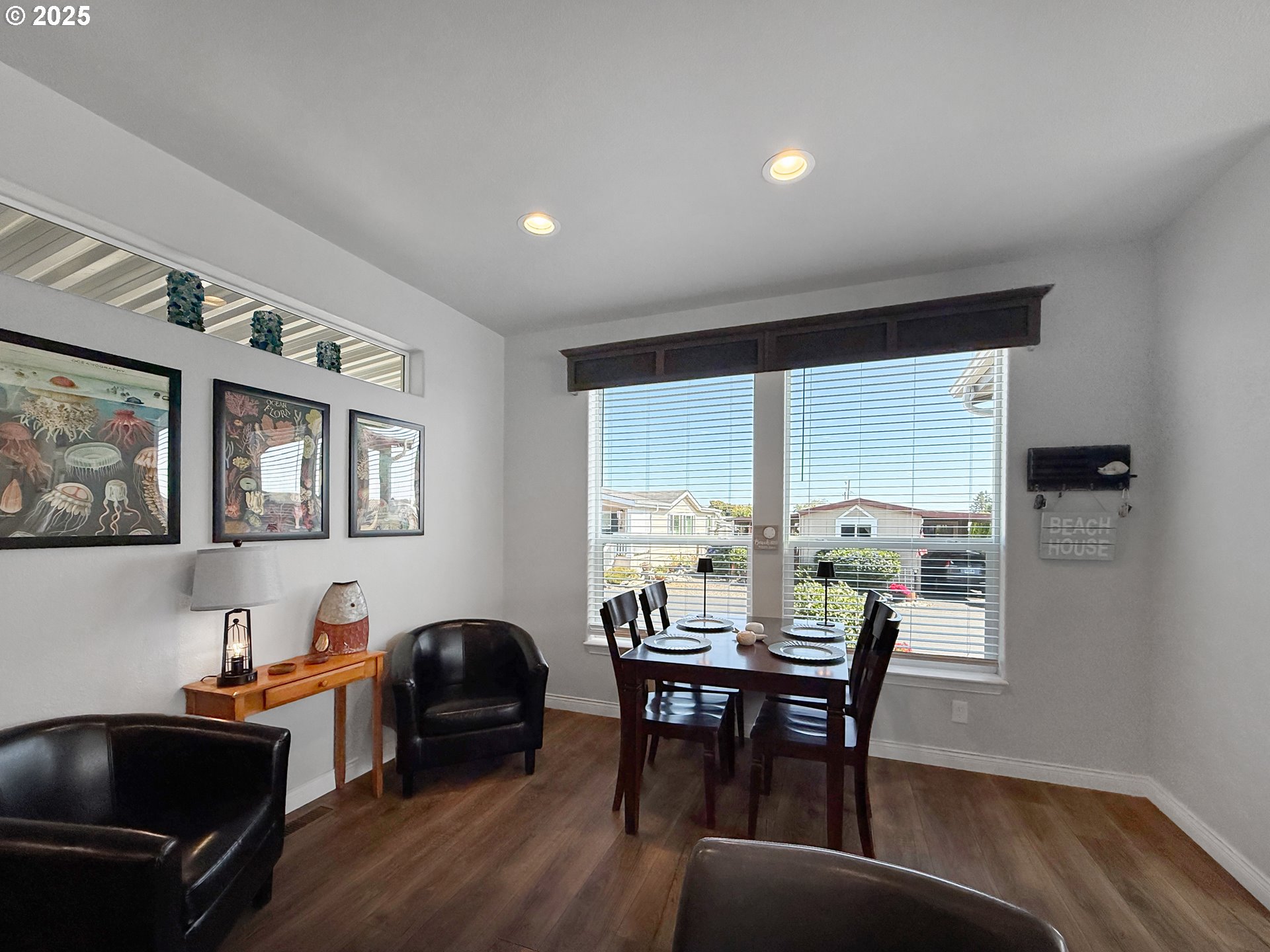 15889 Sunset Strip, Unit 44 Brookings, OR 97415 - Photo 30 of 44 a view of a dining room with furniture window and wooden floor
