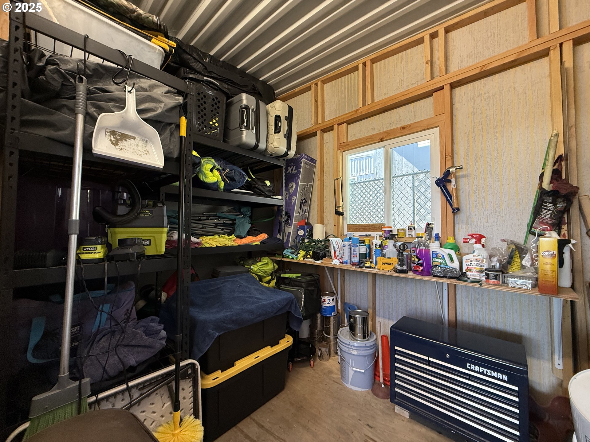 15889 Sunset Strip, Unit 44 Brookings, OR 97415 - Photo 31 of 44 a room with lots of different colored cloths