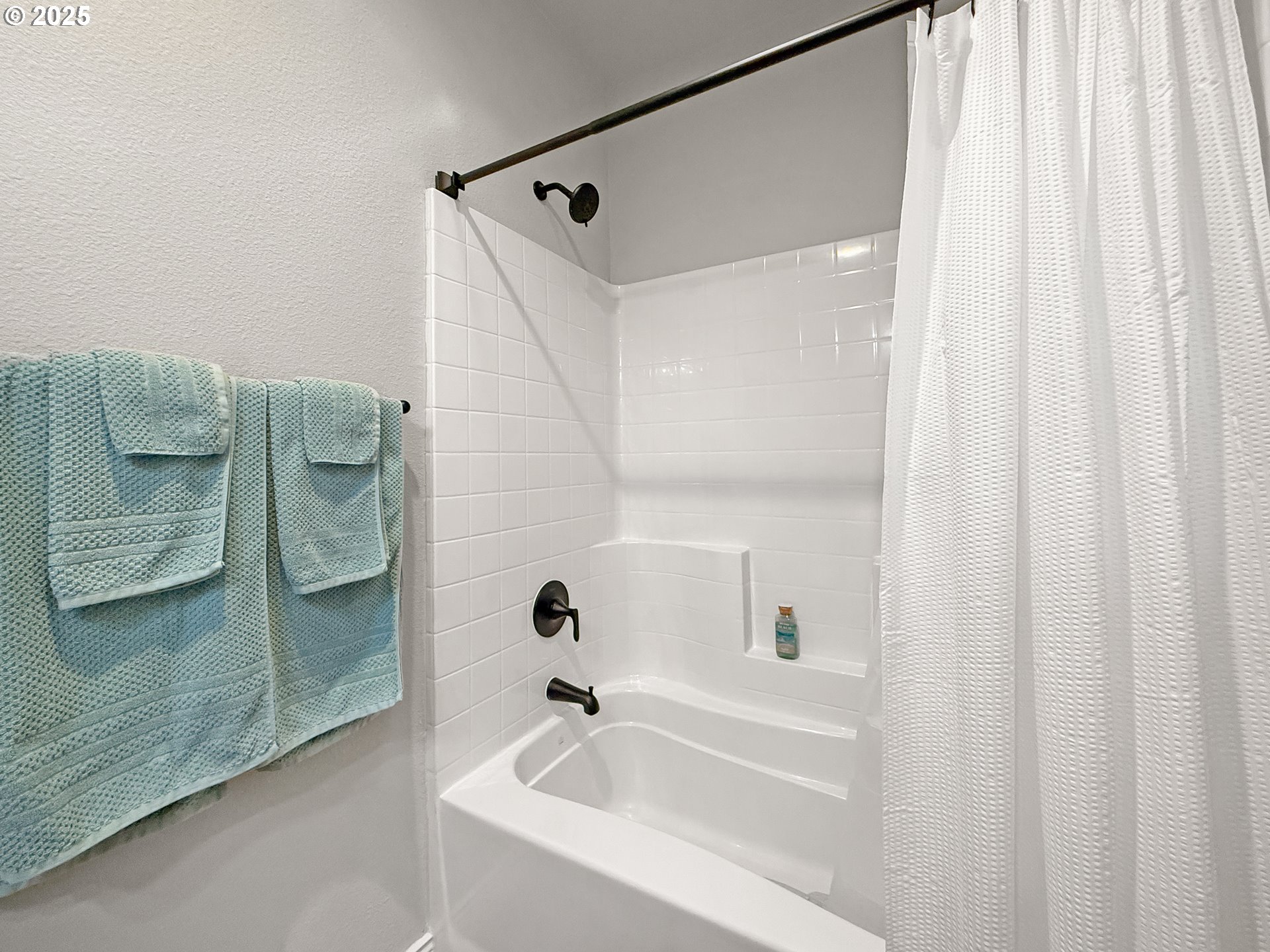 15889 Sunset Strip, Unit 44 Brookings, OR 97415 - Photo 34 of 44 a bathroom with bathtub and shower