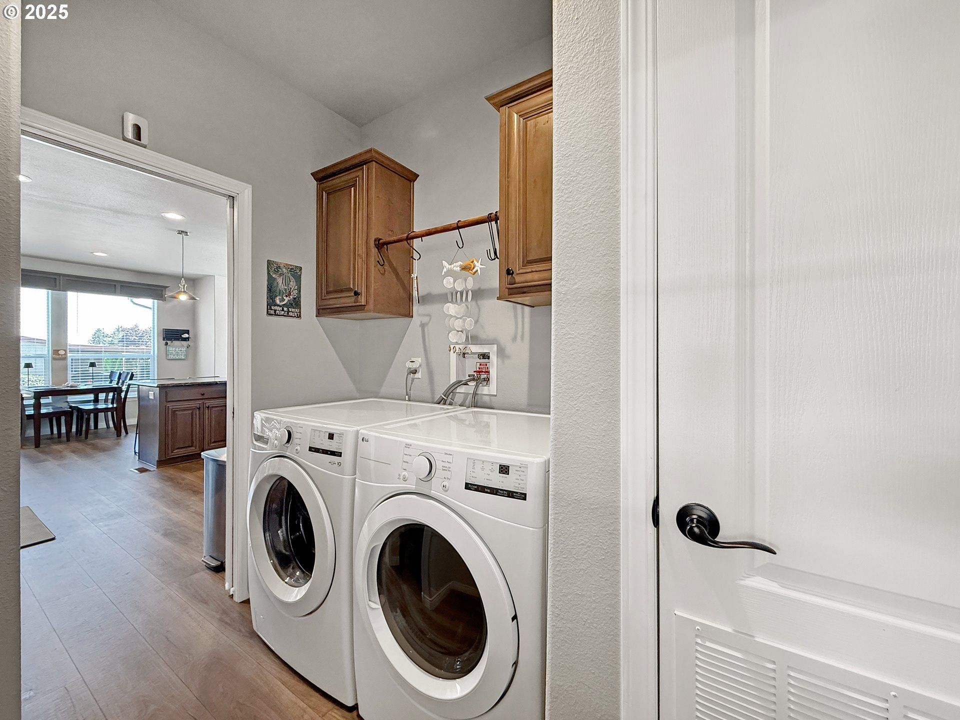 15889 Sunset Strip, Unit 44 Brookings, OR 97415 - Photo 37 of 44 a view of washer and dryer with bathroom in the background