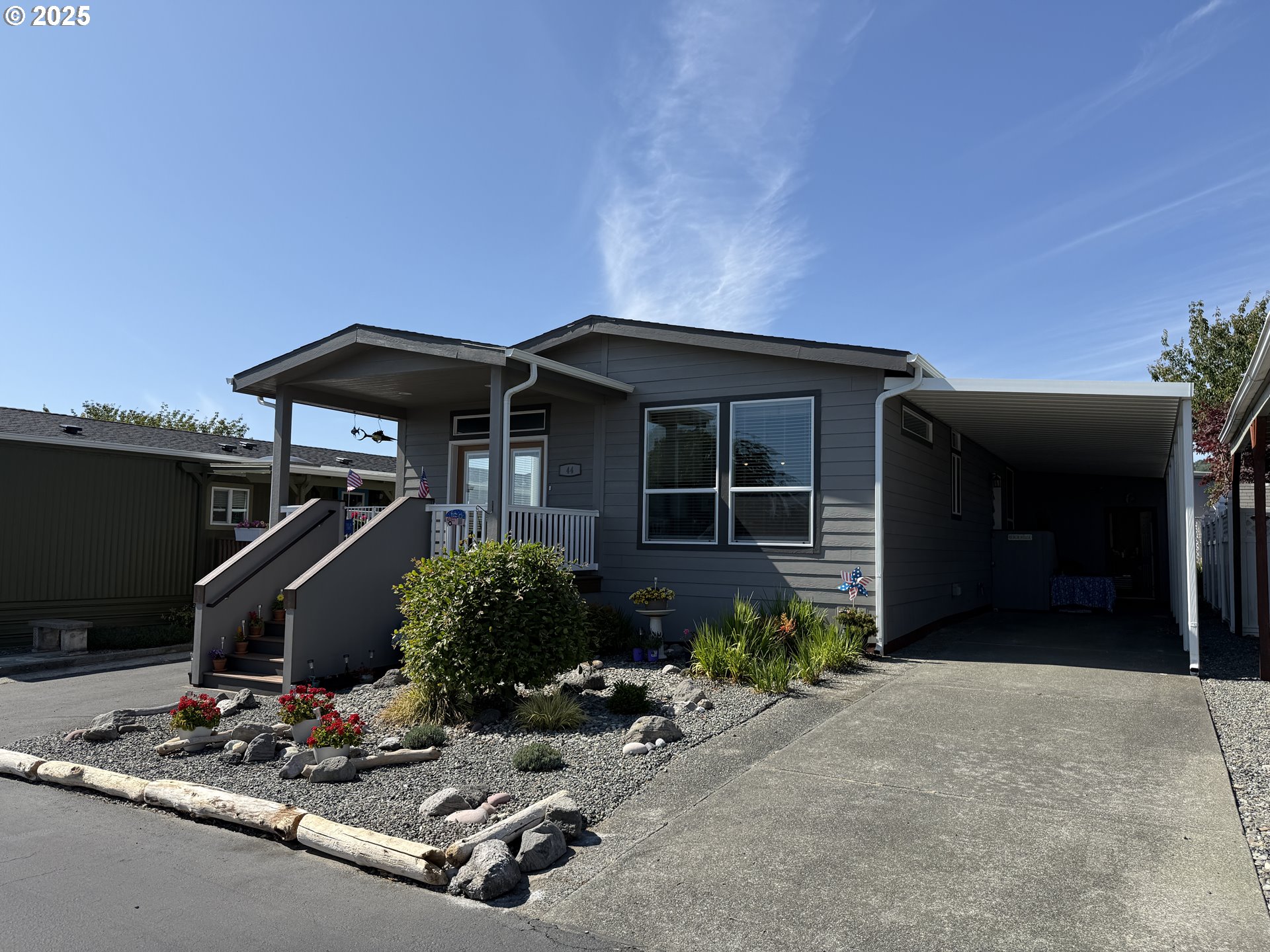 15889 Sunset Strip, Unit 44 Brookings, OR 97415 - Photo 38 of 44 a front view of a house with garage