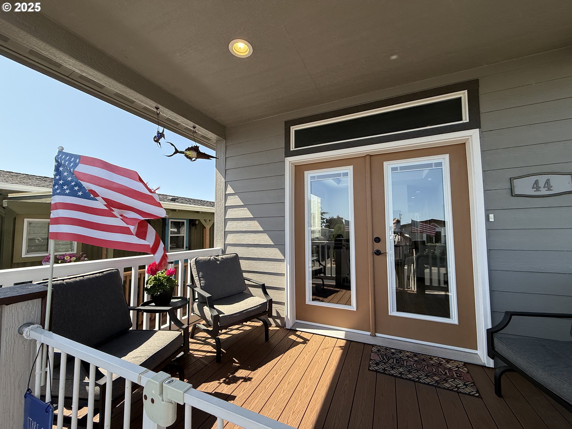 15889 Sunset Strip, Unit 44 Brookings, OR 97415 - Photo 6 of 44 a view of a chairs and tables in the balcony
