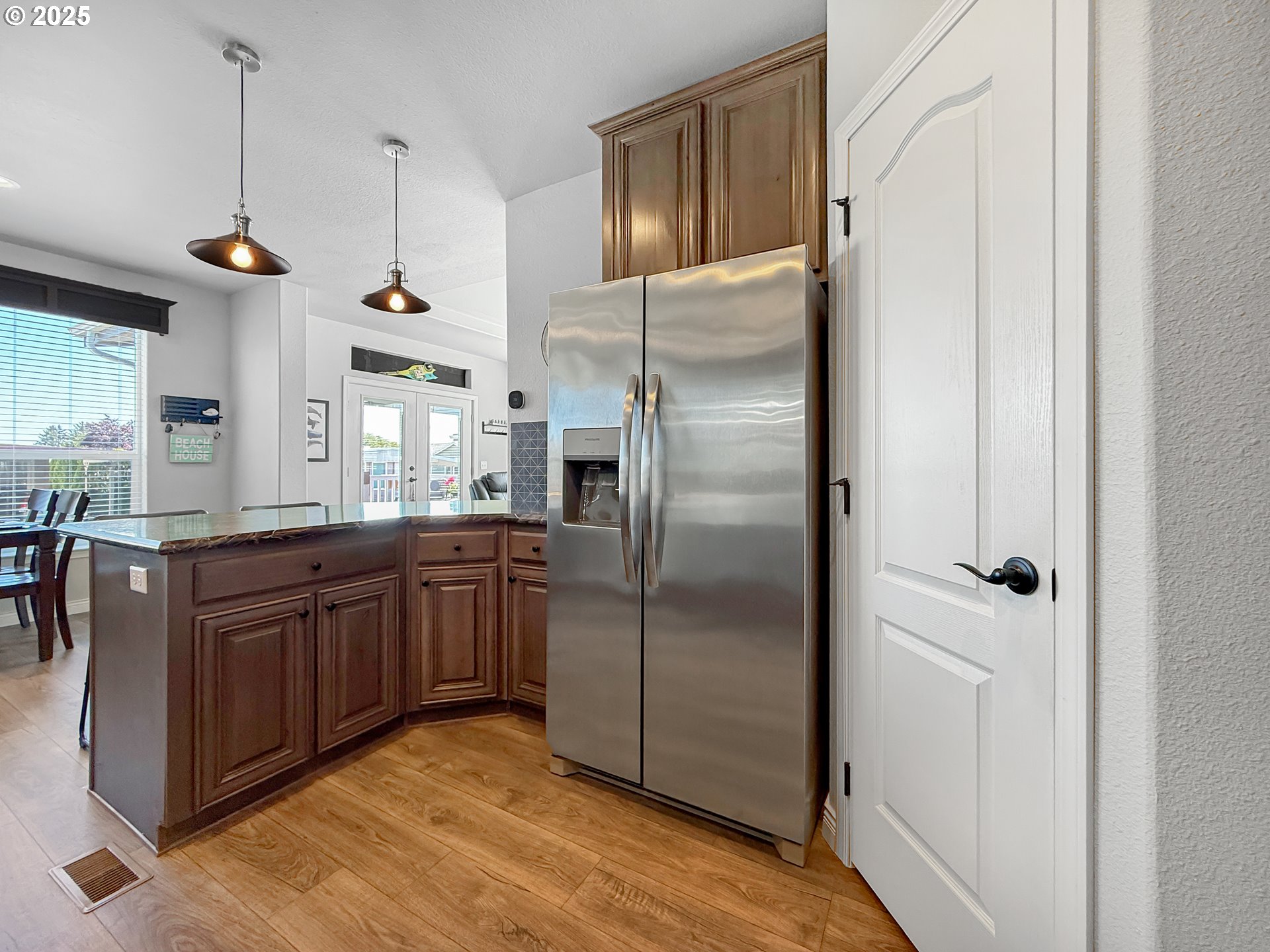 15889 Sunset Strip, Unit 44 Brookings, OR 97415 - Photo 10 of 44 a kitchen with stainless steel appliances granite countertop a refrigerator and a sink