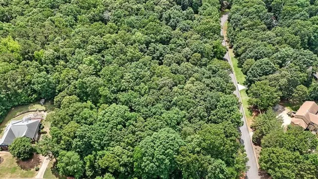a view of a house with a tree