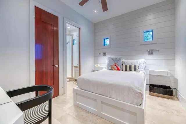 a bedroom with a bed and a cabinets