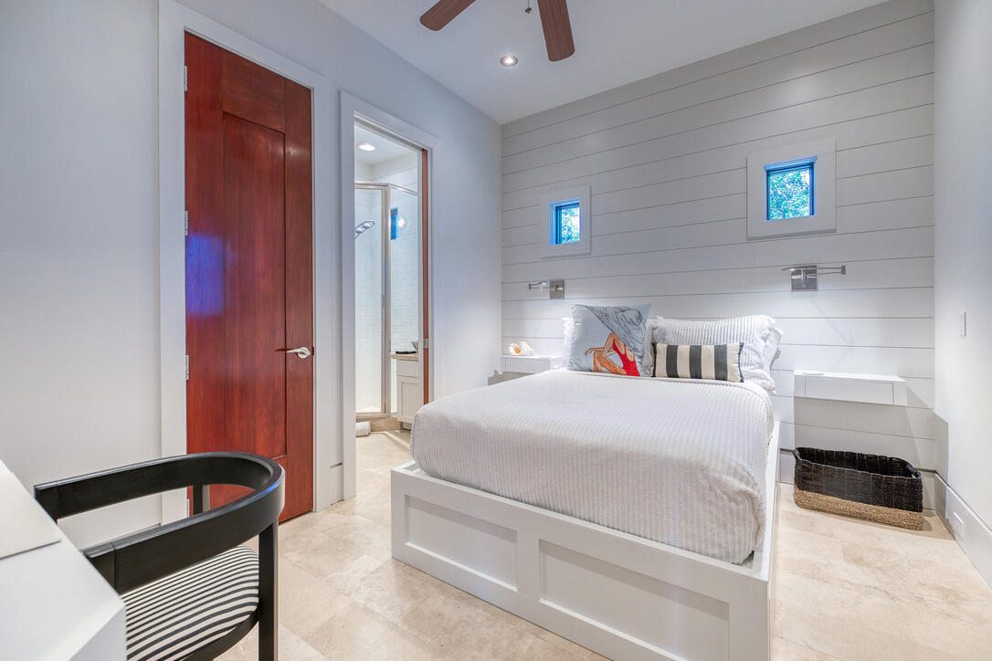 210 Village Way Panama City Beach, FL 32413 - Photo 12 of 56 a bedroom with a bed and a cabinets