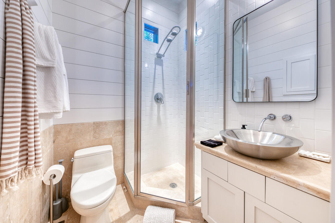 210 Village Way Panama City Beach, FL 32413 - Photo 13 of 56 a bathroom with a toilet sink and mirror