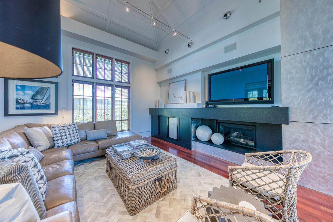 210 Village Way Panama City Beach, FL 32413 - Photo 23 of 56 a living room with furniture and a fireplace