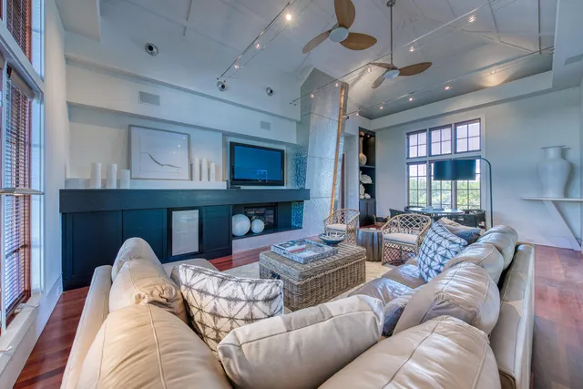 a living room with furniture fireplace and a flat screen tv