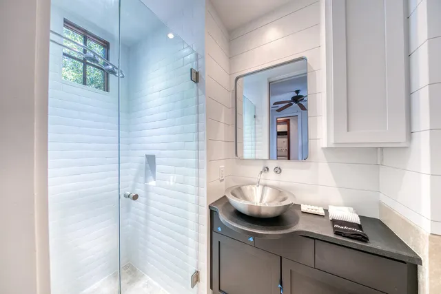 an aerial view of a house with yard and ocean view