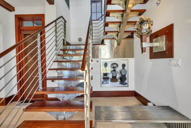 a view of staircase with white walls