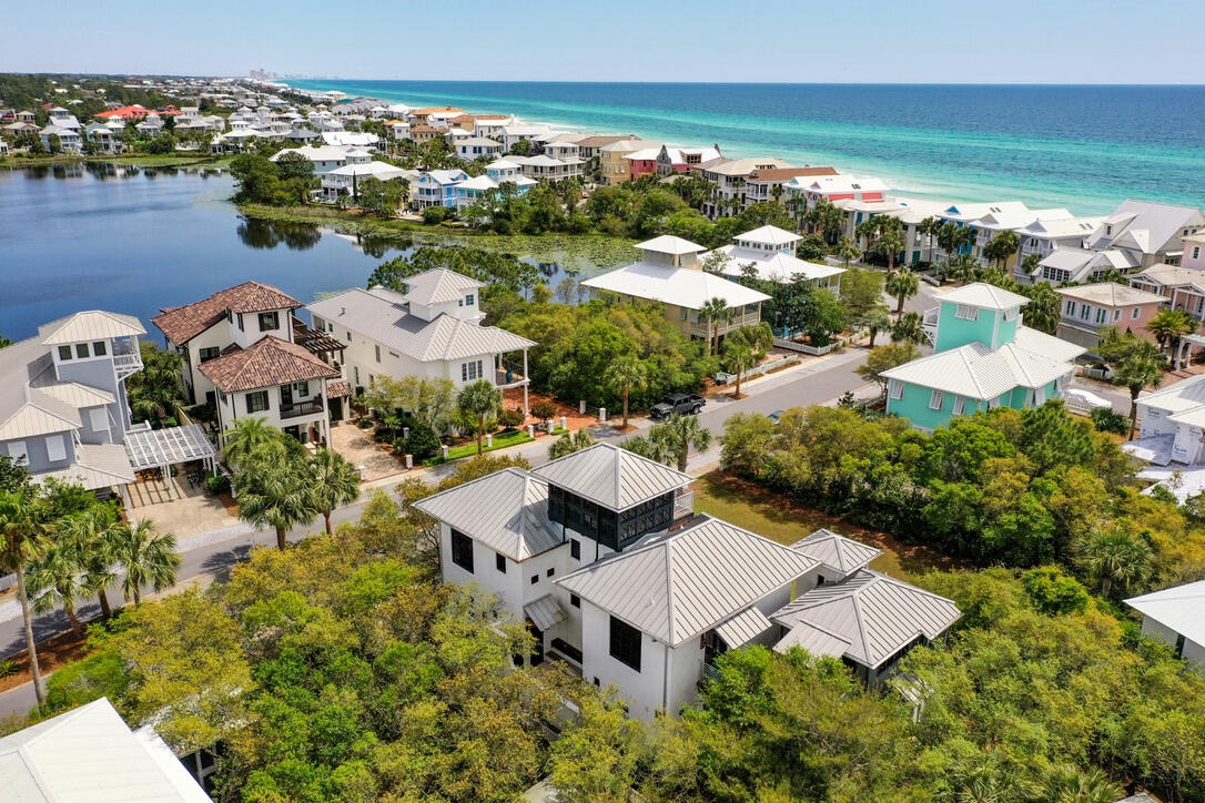 210 Village Way Panama City Beach, FL 32413 - Photo 43 of 56 an aerial view of multiple houses with yard