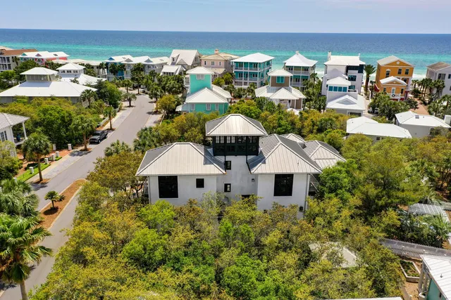 an aerial view of residential houses with outdoor space