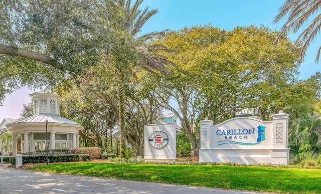 a view of a swimming pool and an outdoor seating