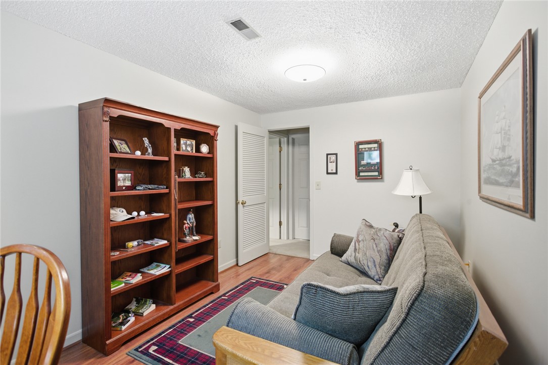 6 Tradewinds Way Salem, SC 29676 - Photo 26 of 50 This versatile room features hardwood floors and a built-in bookshelf, offering functional elegance.