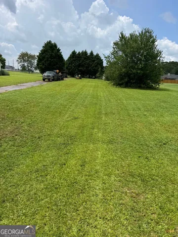 a view of a field with a yard