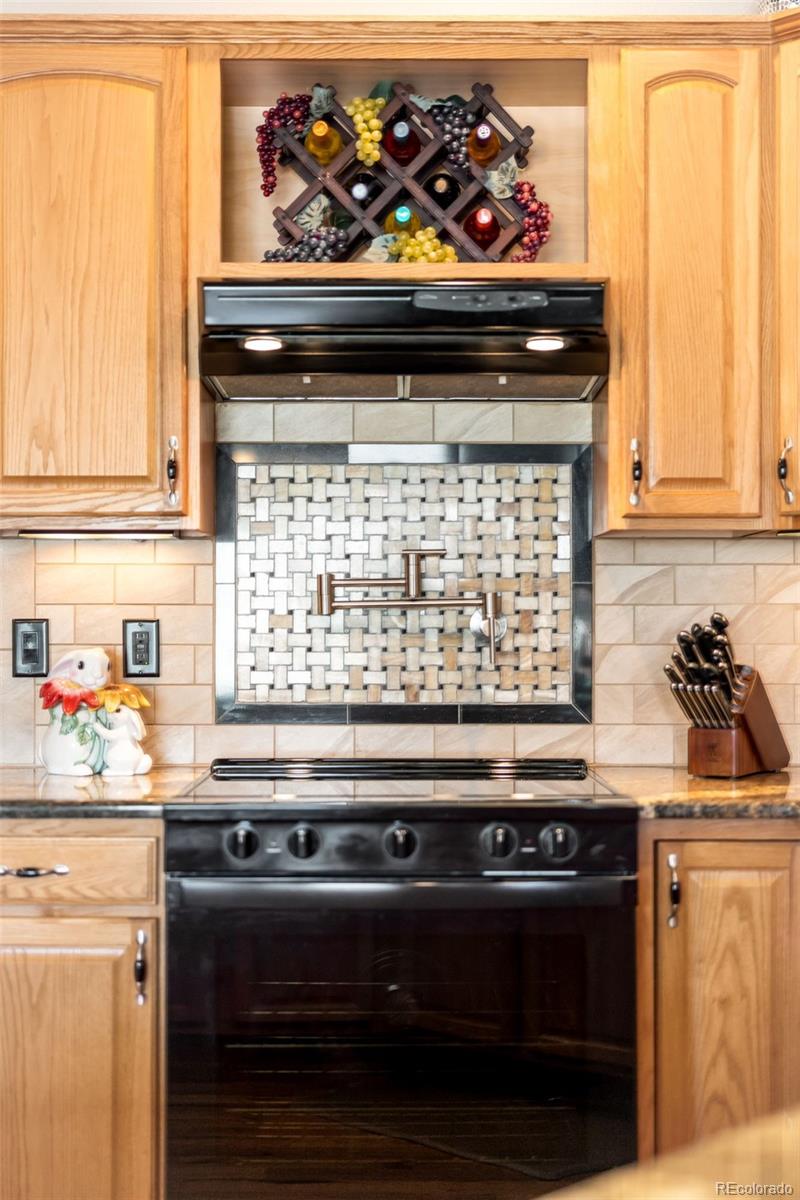 2013 Trail Ridge Drive Severance, CO 80615 - Photo 15 of 49 a stove top oven sitting inside of a kitchen
