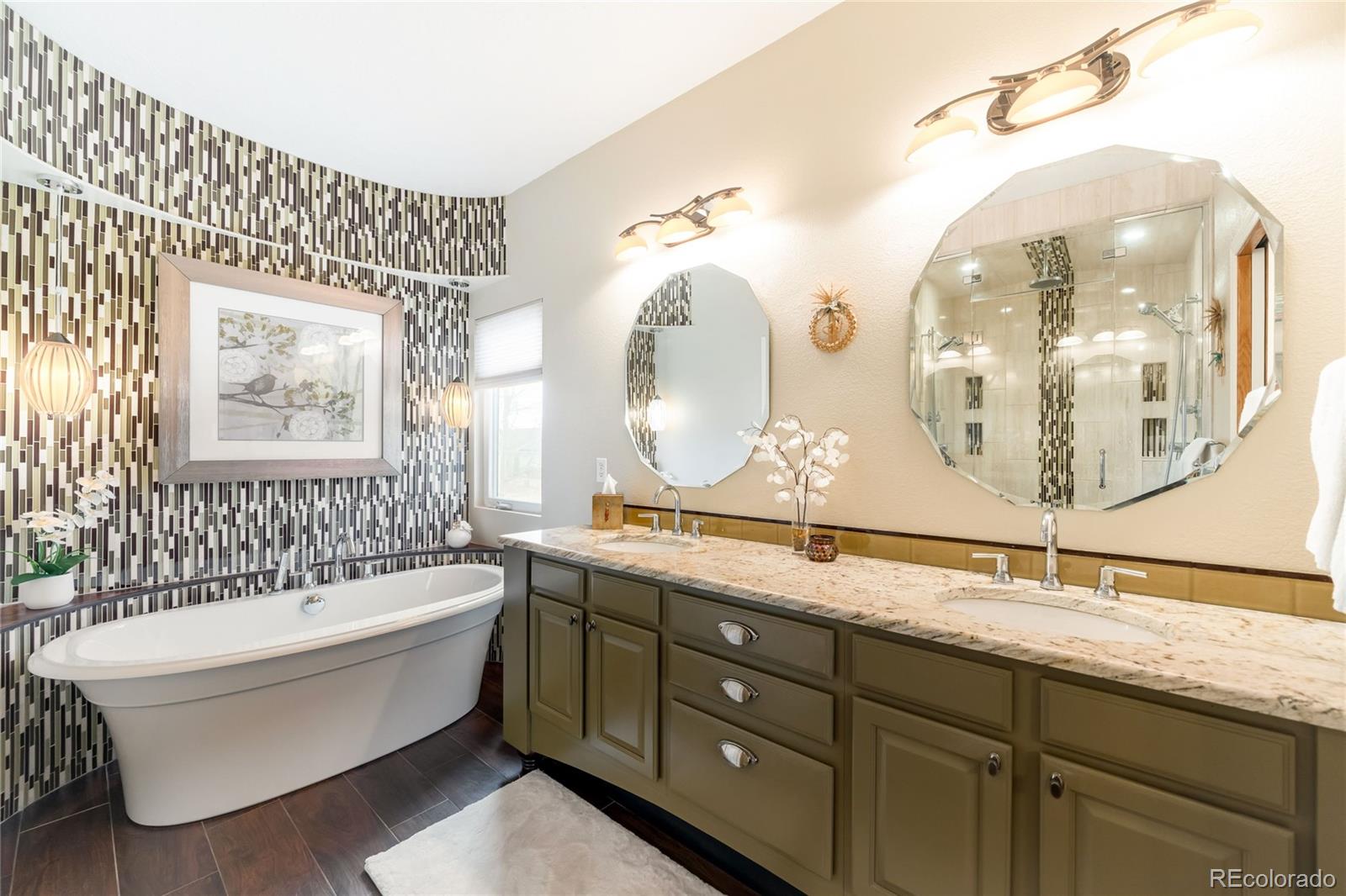 2013 Trail Ridge Drive Severance, CO 80615 - Photo 20 of 49 a bathroom with a double vanity sink mirror and bathtub