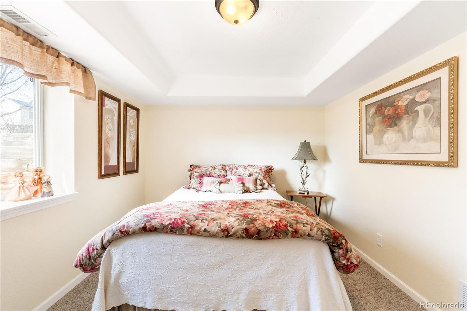 2013 Trail Ridge Drive Severance, CO 80615 - Photo 24 of 49 a bedroom with a bed and a window