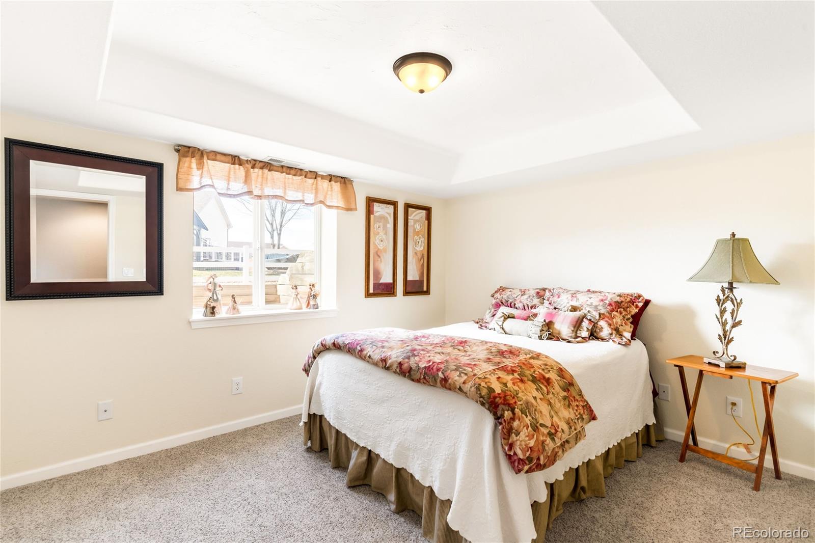 2013 Trail Ridge Drive Severance, CO 80615 - Photo 25 of 49 a bedroom with a bed and a window