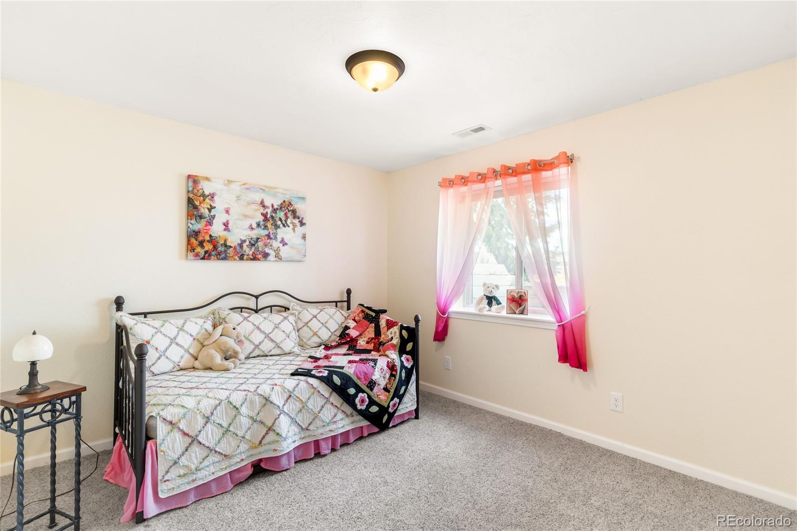 2013 Trail Ridge Drive Severance, CO 80615 - Photo 26 of 49 a bedroom with furniture and a window