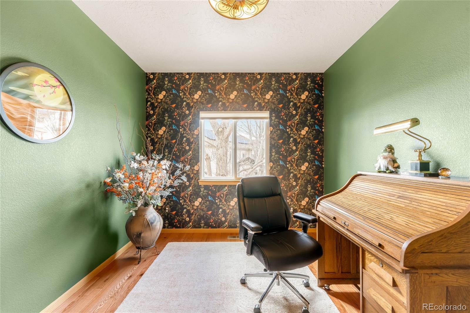 2013 Trail Ridge Drive Severance, CO 80615 - Photo 28 of 49 a living room with furniture and a potted plant